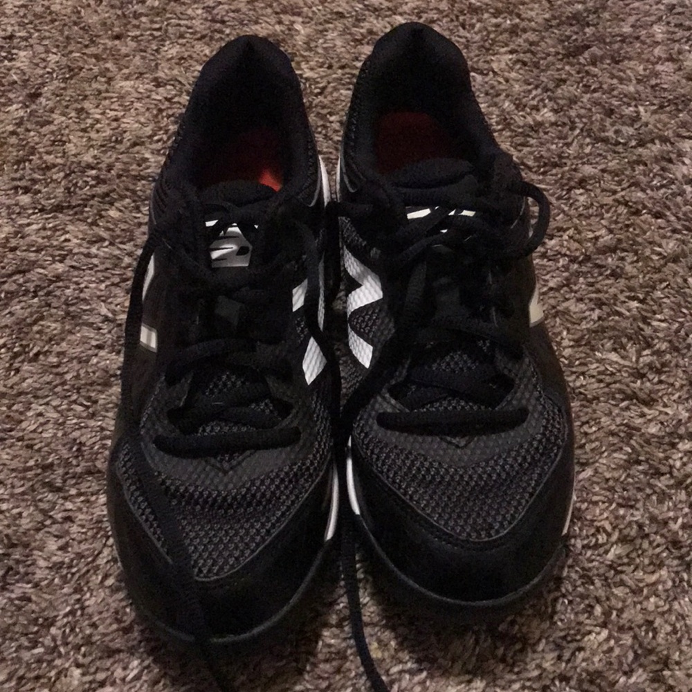 Boys black and white baseball cleats